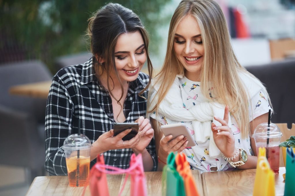 two young business woman are happy with new hand crafted website designs by web design dublin services